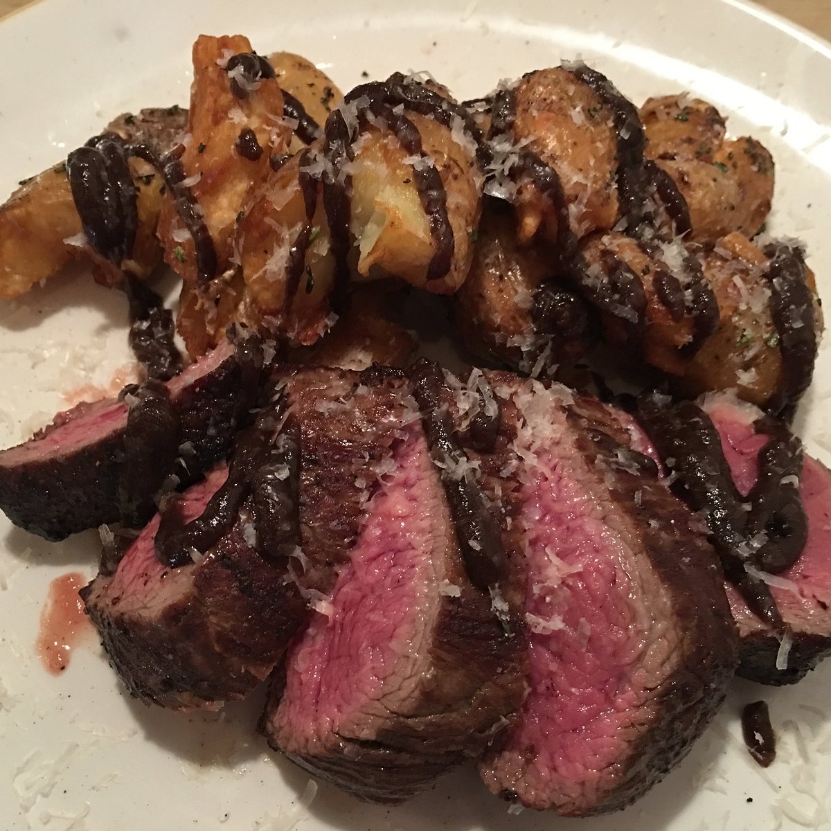 Viaggio Ristorante signature dishes Hanger Steak, Cauliflower Fritti, Charred Octopus.